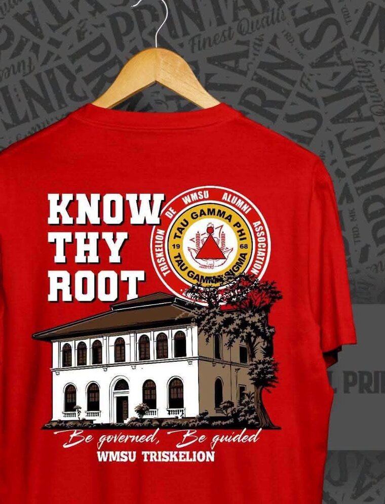 Back print of the 2026 shirt: Know Thy Root and the alumni association seal above the campus building, with Be governed, Be guided and WMSU Triskelion below.